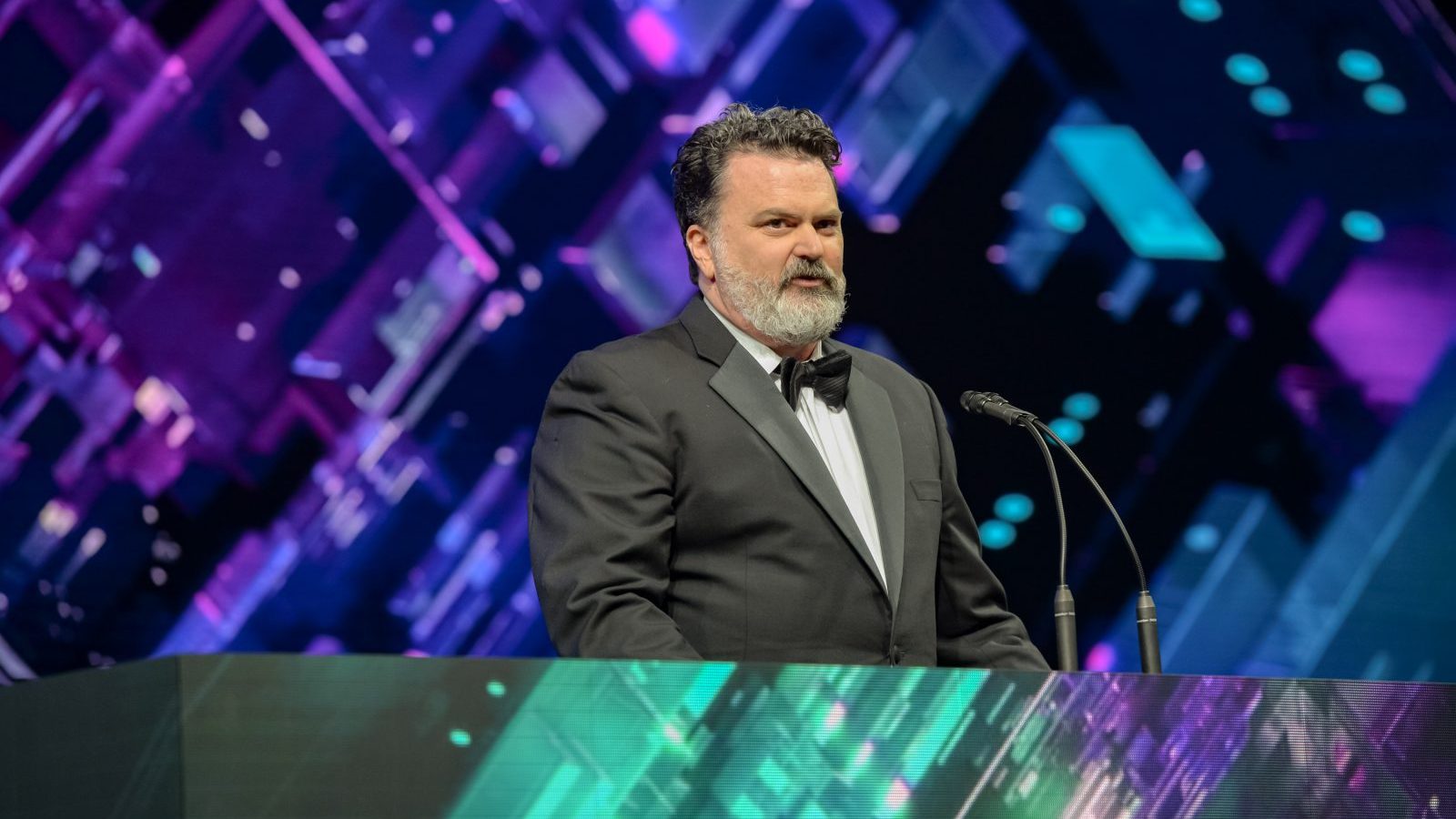 Tim Schafer, CEO and founder of Double Fine Productions, speaking at the 2018 Game Developers Choice Awards