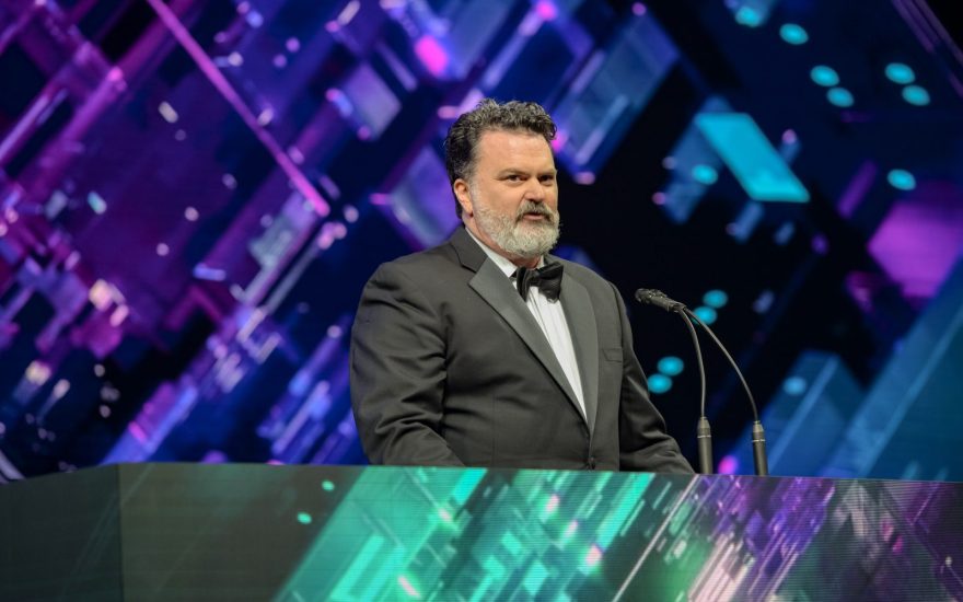 Tim Schafer, CEO and founder of Double Fine Productions, speaking at the 2018 Game Developers Choice Awards